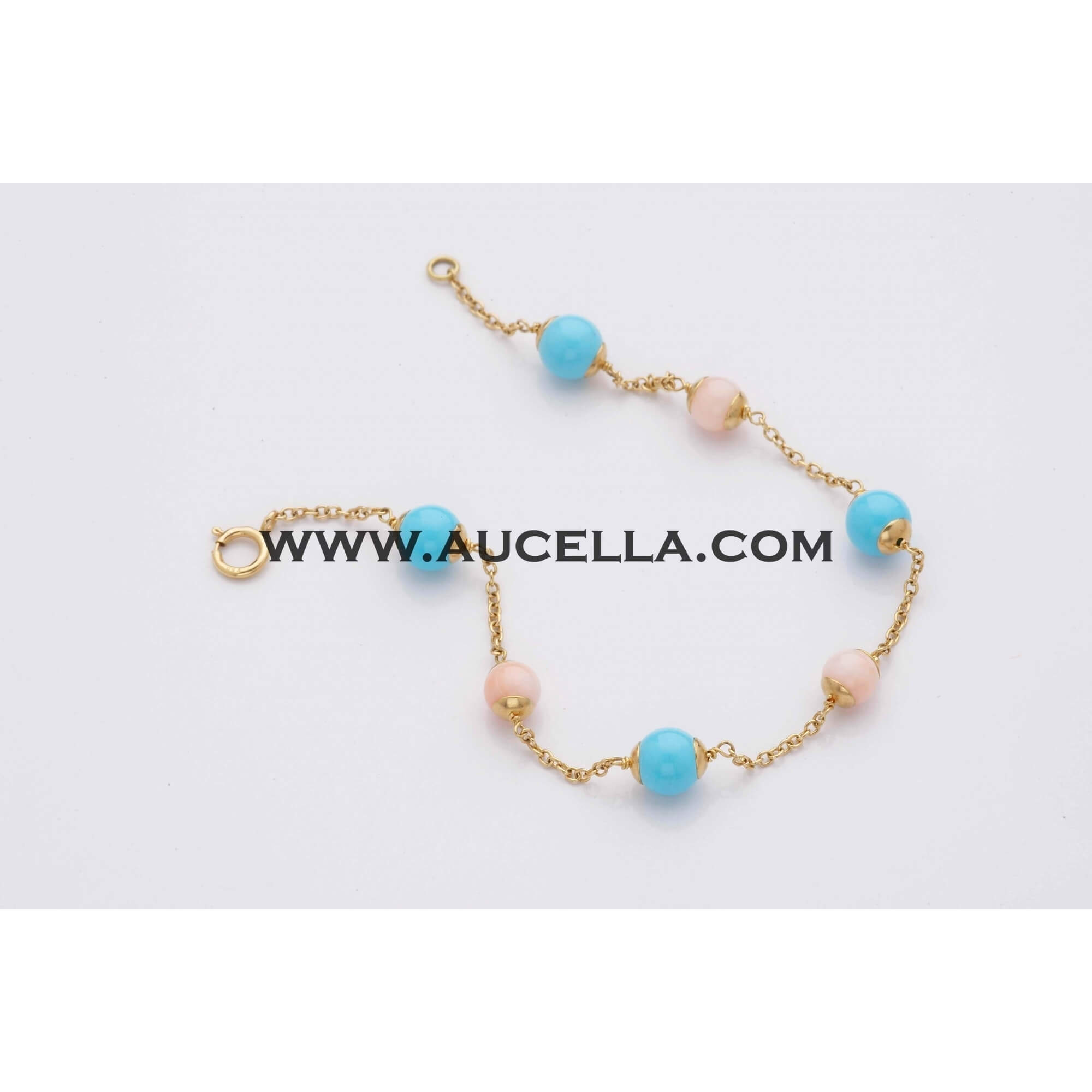 Bracelet set in gold with turquoise and pink coral