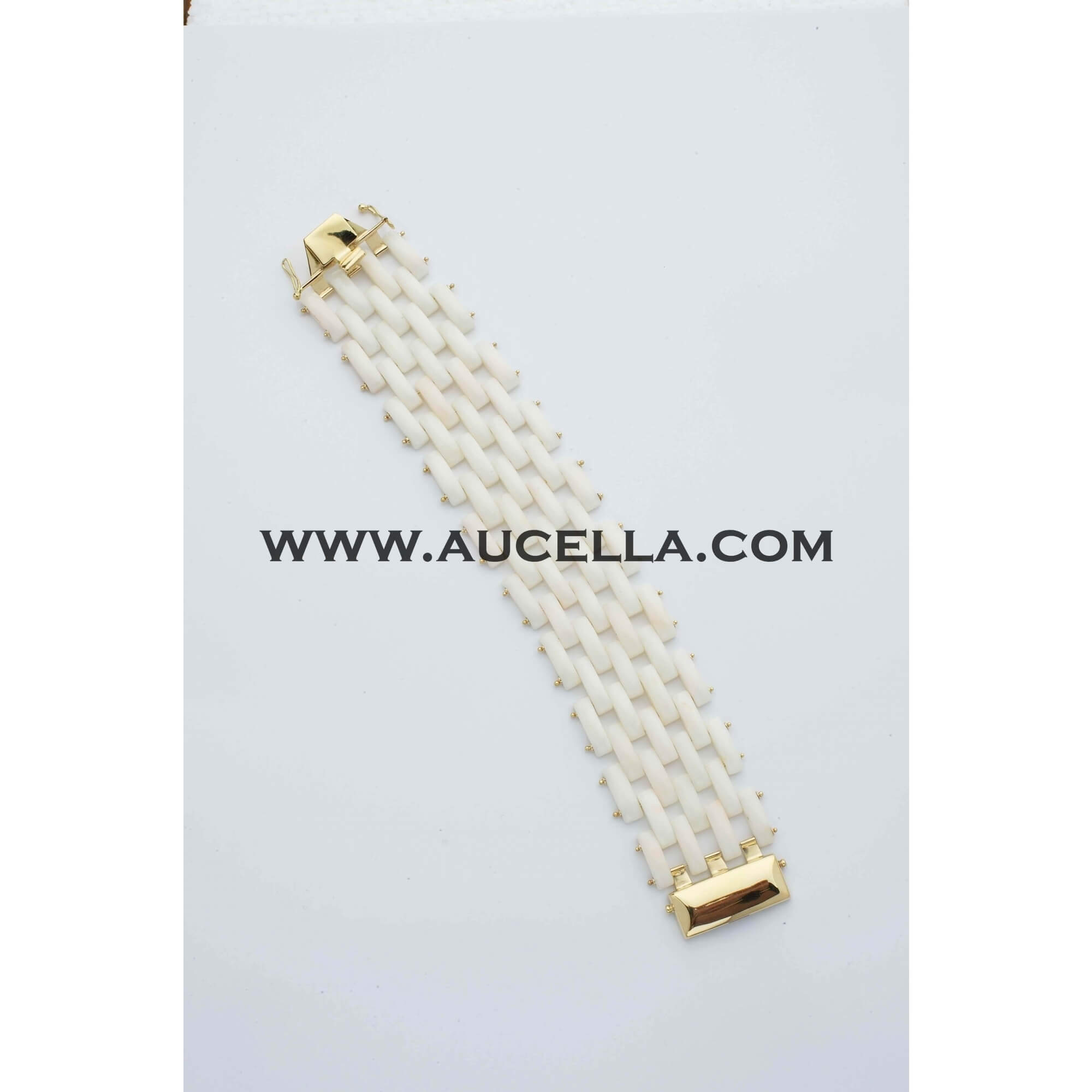 Gold bracelet with natural white coral