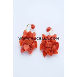 Earrings set in gold with carving coral