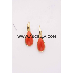 Earrings set in gold with red coral drops