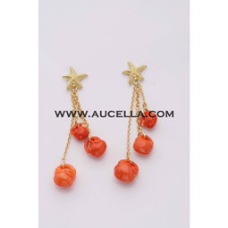 Earrings set in gold with coral carving