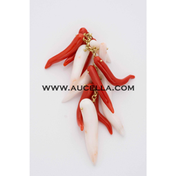 Pendant set in gold with coral horns