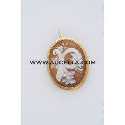 Pendant set in gold with carving cameo