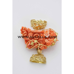 Clasp set in gold with pink coral carving 