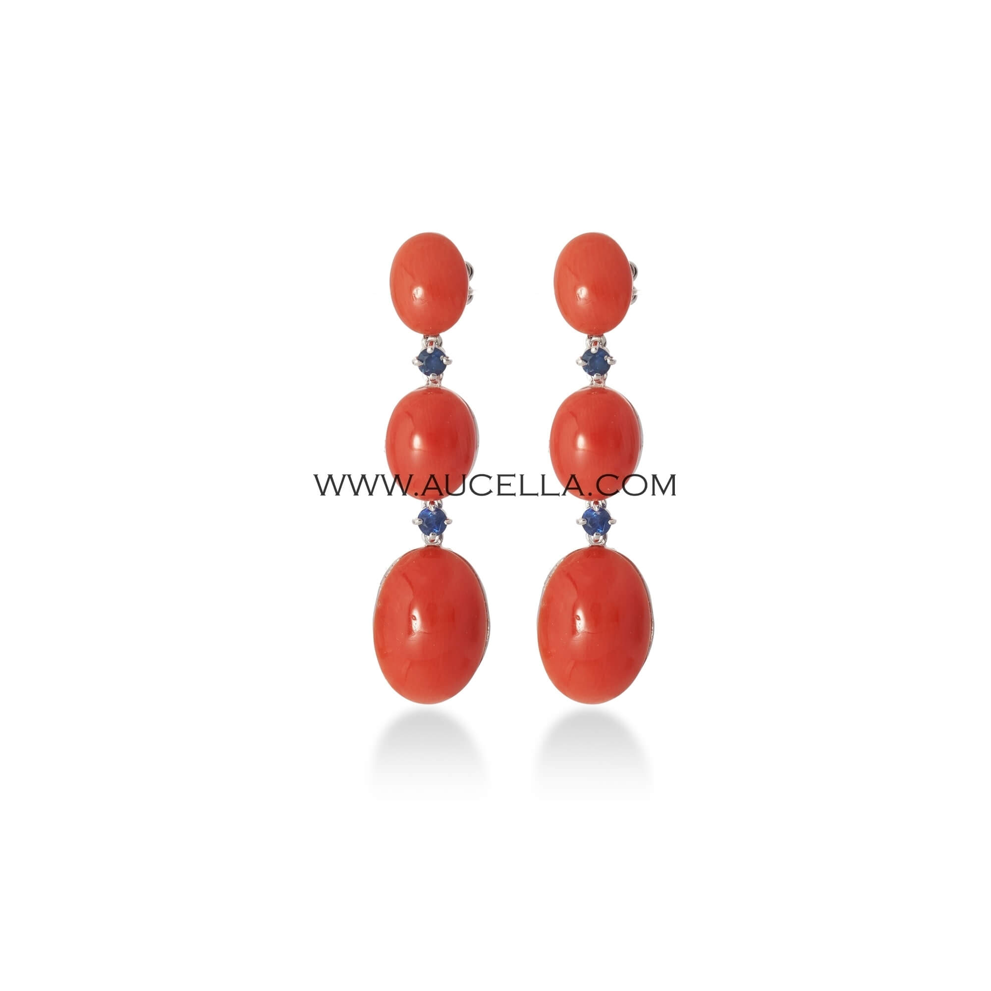 Natural red coral with shappires set in gold 