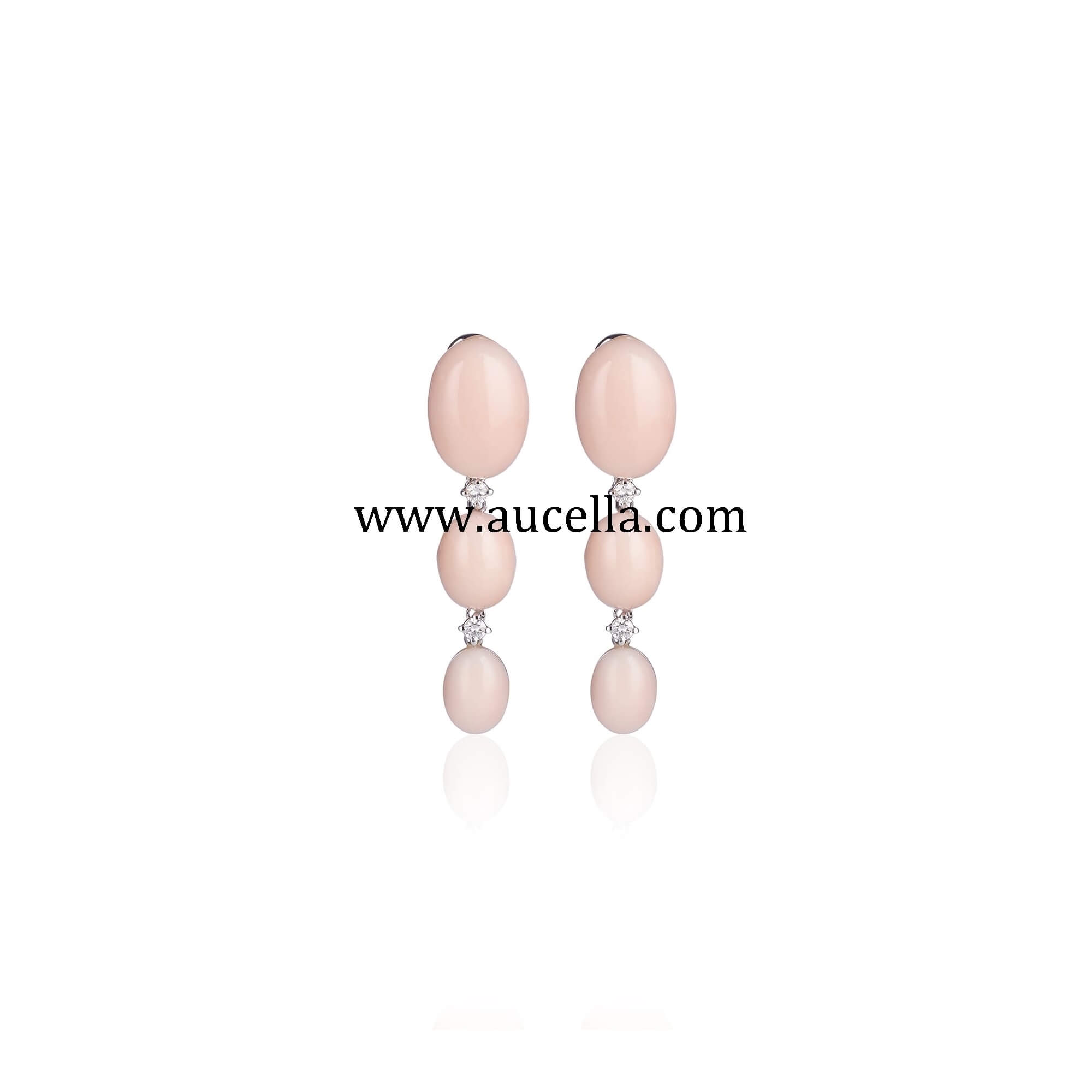 Earrings set in gold with natural pink coral